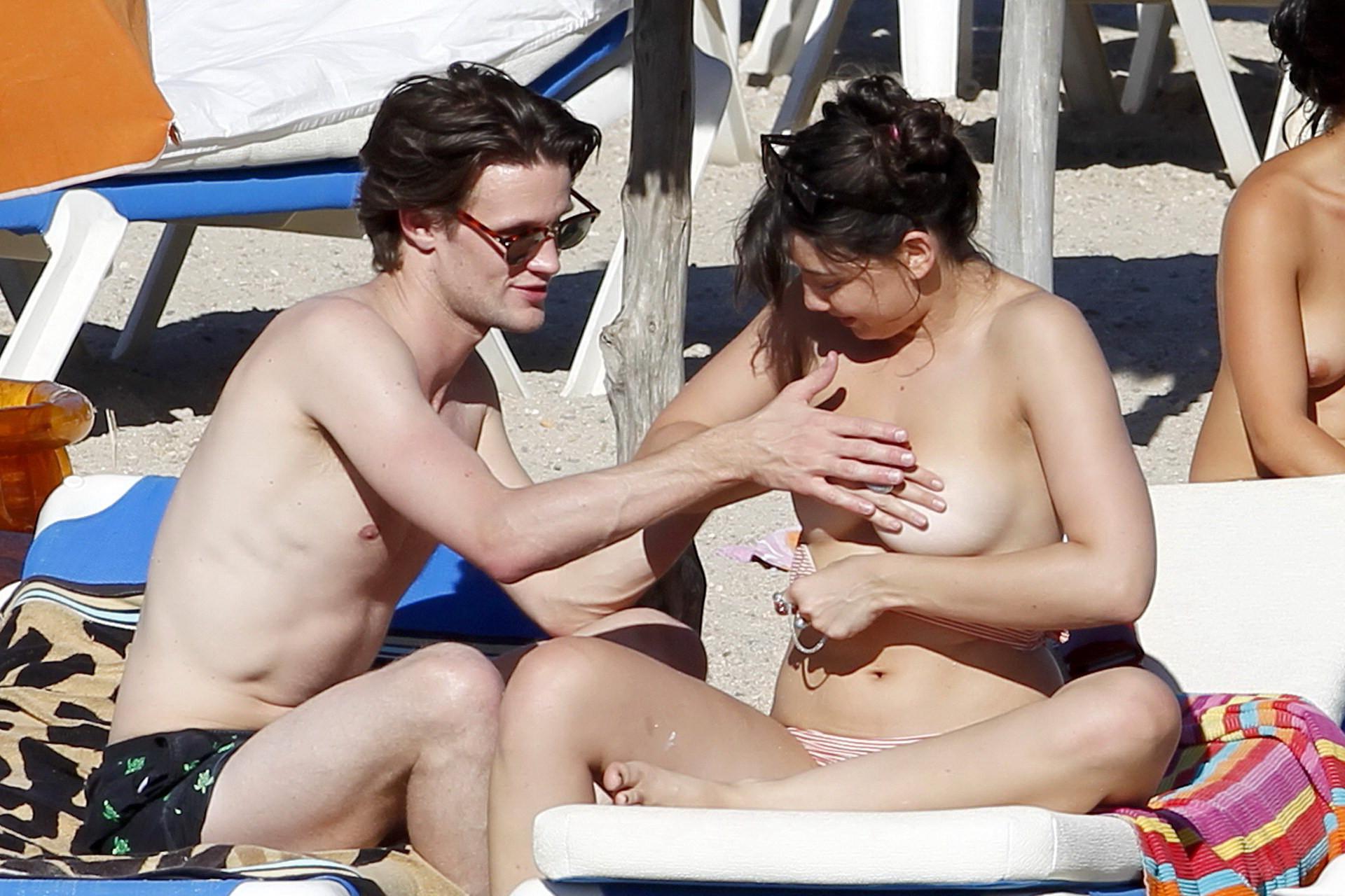 15P Daisy Lowe topless tanning her big boobs on the beach in Ibiza