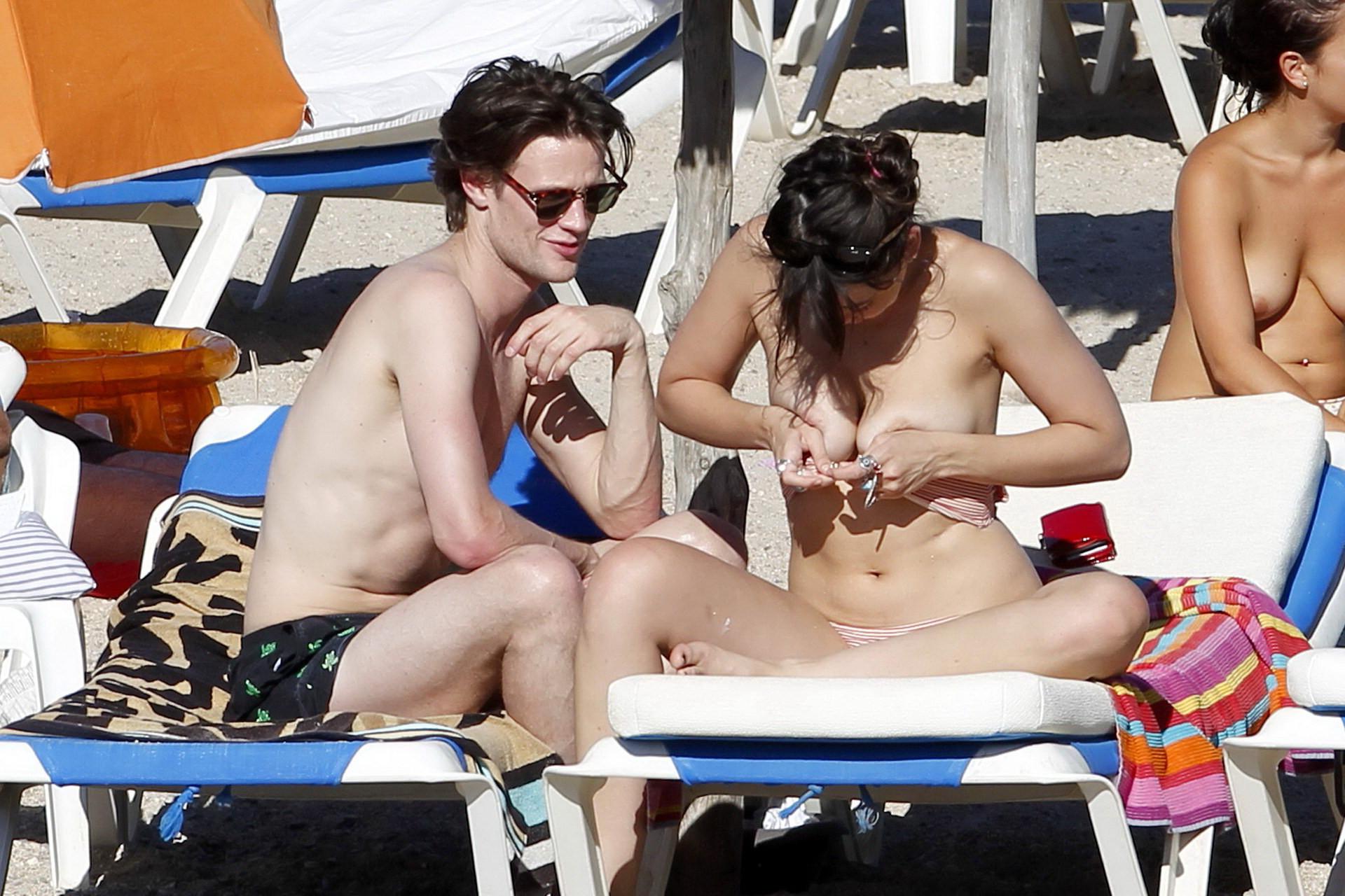 15P Daisy Lowe topless tanning her big boobs on the beach in Ibiza