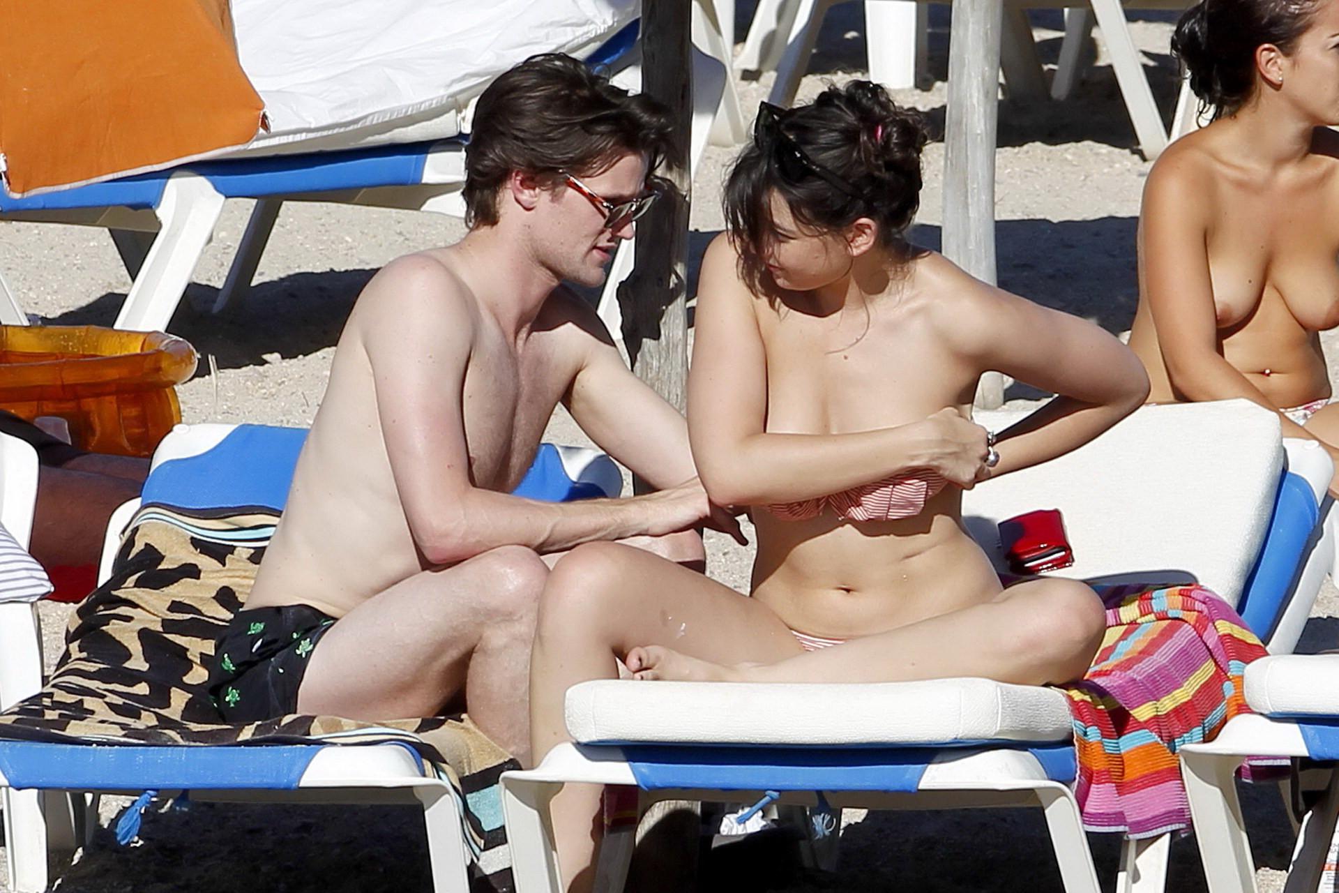 15P Daisy Lowe topless tanning her big boobs on the beach in Ibiza