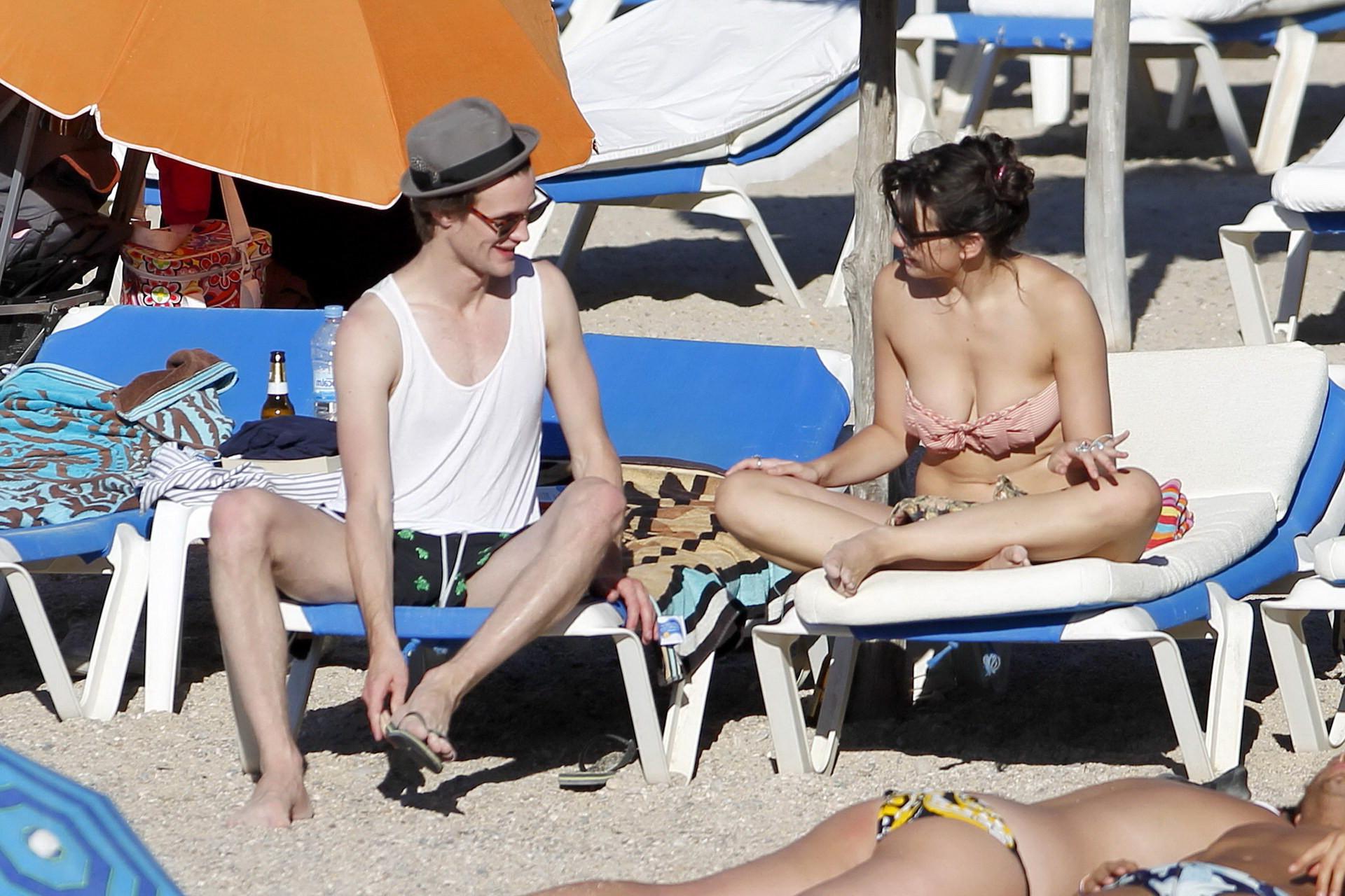 15P Daisy Lowe topless tanning her big boobs on the beach in Ibiza