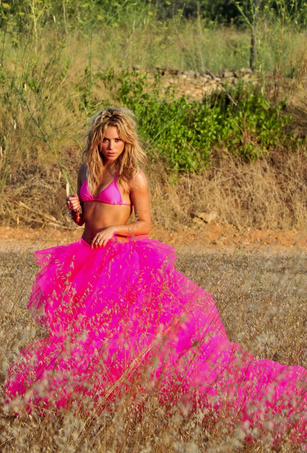 15P Shakira Ripoll wearing pink bikini top  skirt at the outdoor photoshoot