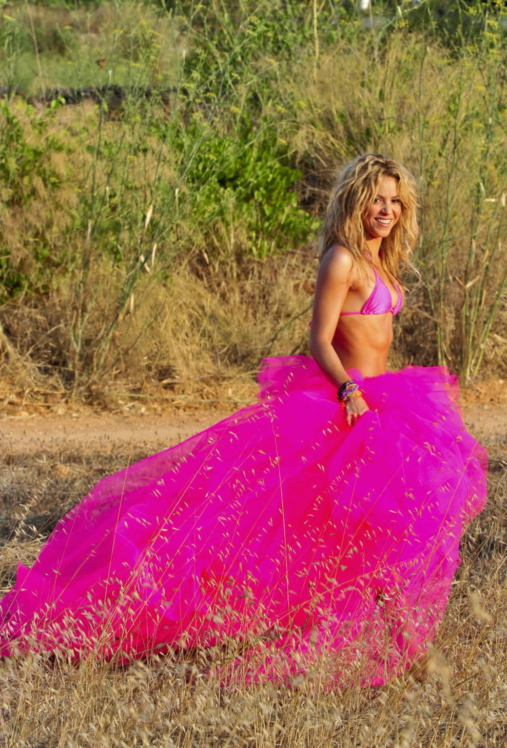 15P Shakira Ripoll wearing pink bikini top  skirt at the outdoor photoshoot