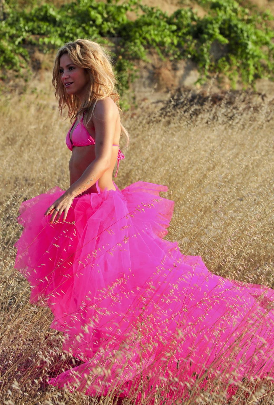 15P Shakira Ripoll wearing pink bikini top  skirt at the outdoor photoshoot