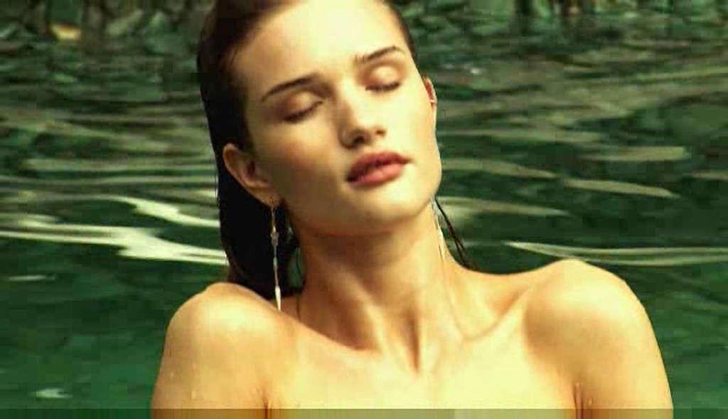 16P Rosie Huntington exposing her nice tits while filming for photoshoot