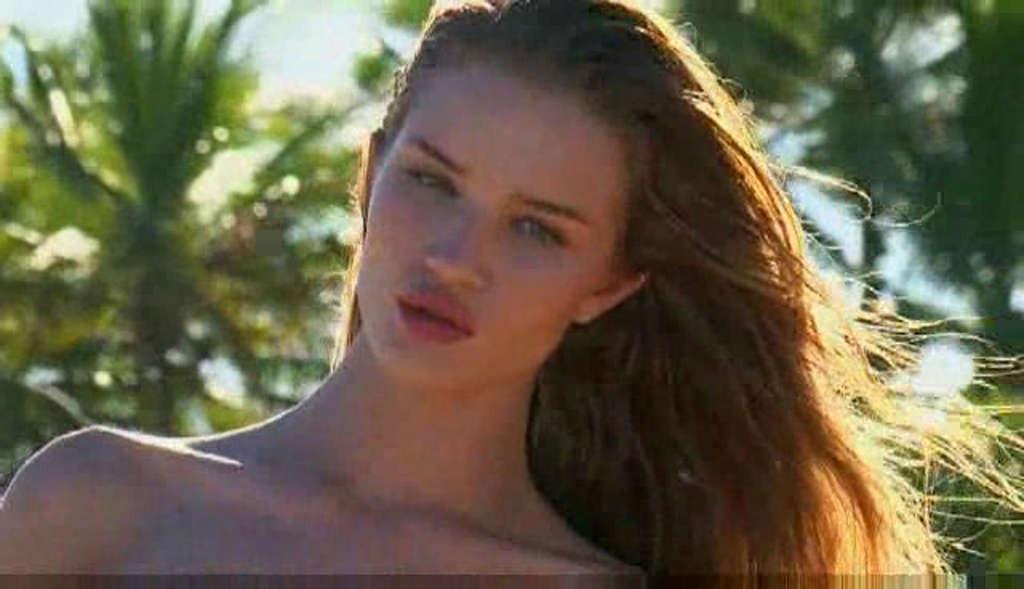 16P Rosie Huntington exposing her nice tits while filming for photoshoot