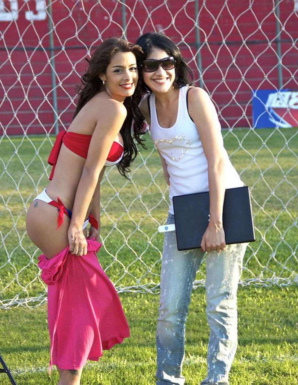 16P Larissa Riquelme with cell phone between her big tits
