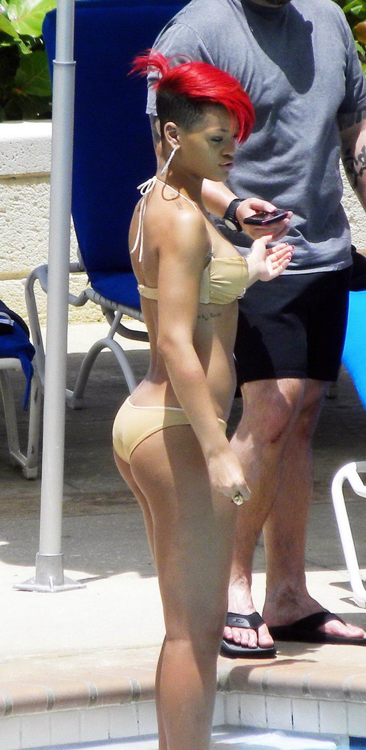 15P Rihanna showing some ass crack in wet bikini poolside in Barbados