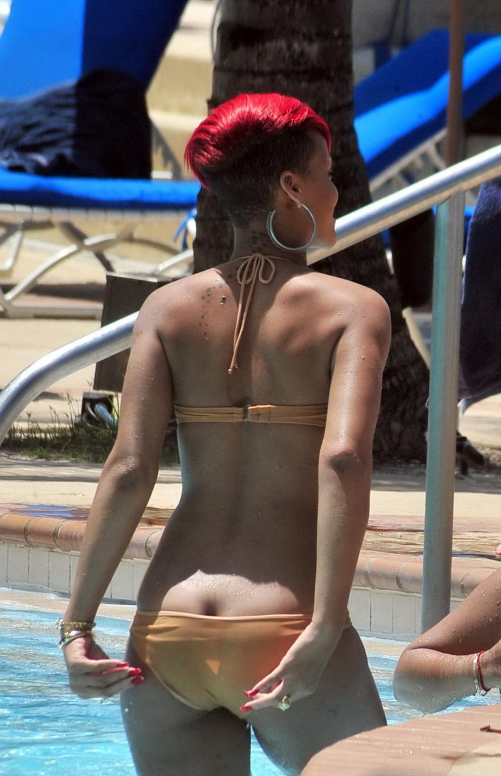 15P Rihanna showing some ass crack in wet bikini poolside in Barbados