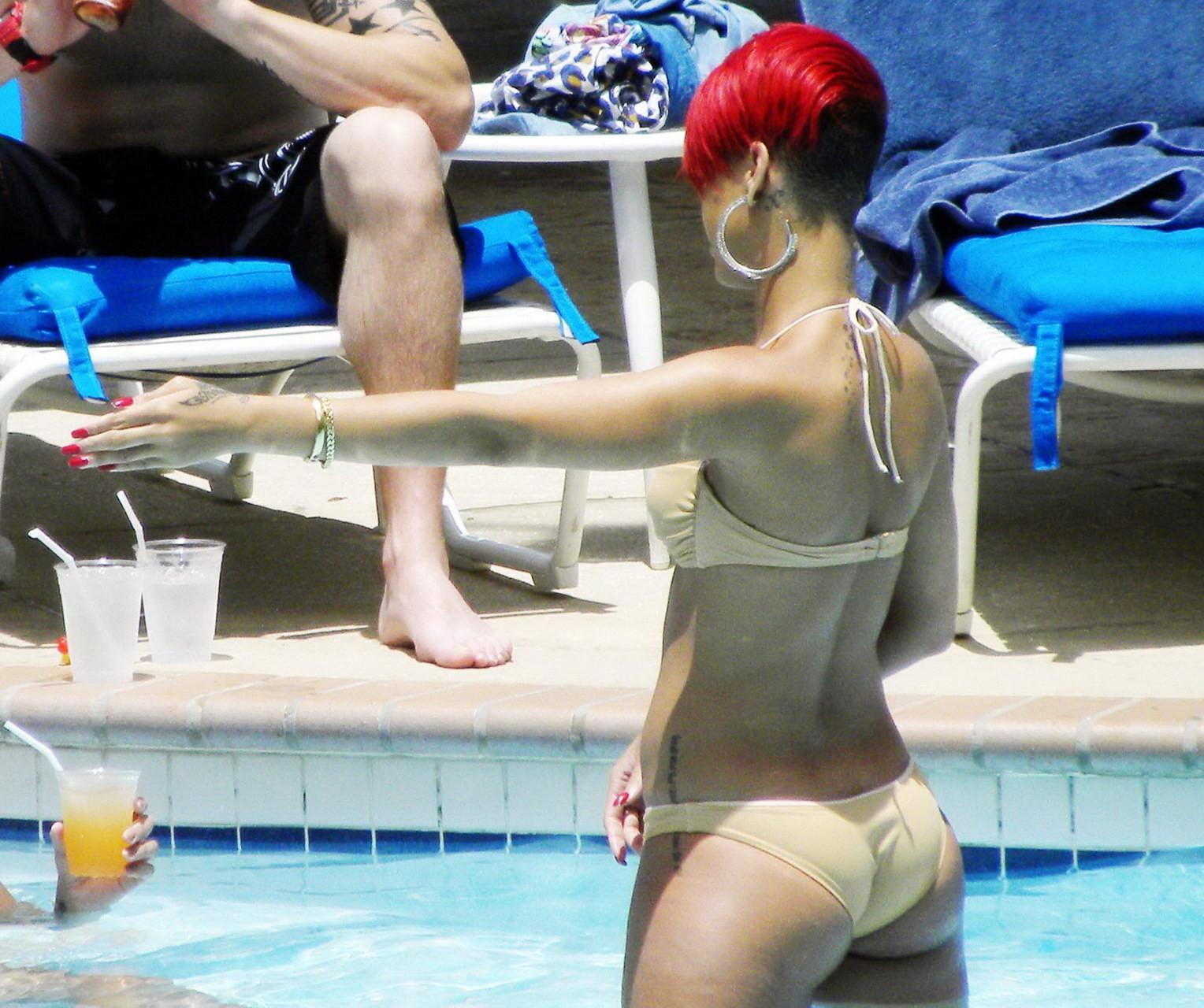 15P Rihanna showing some ass crack in wet bikini poolside in Barbados