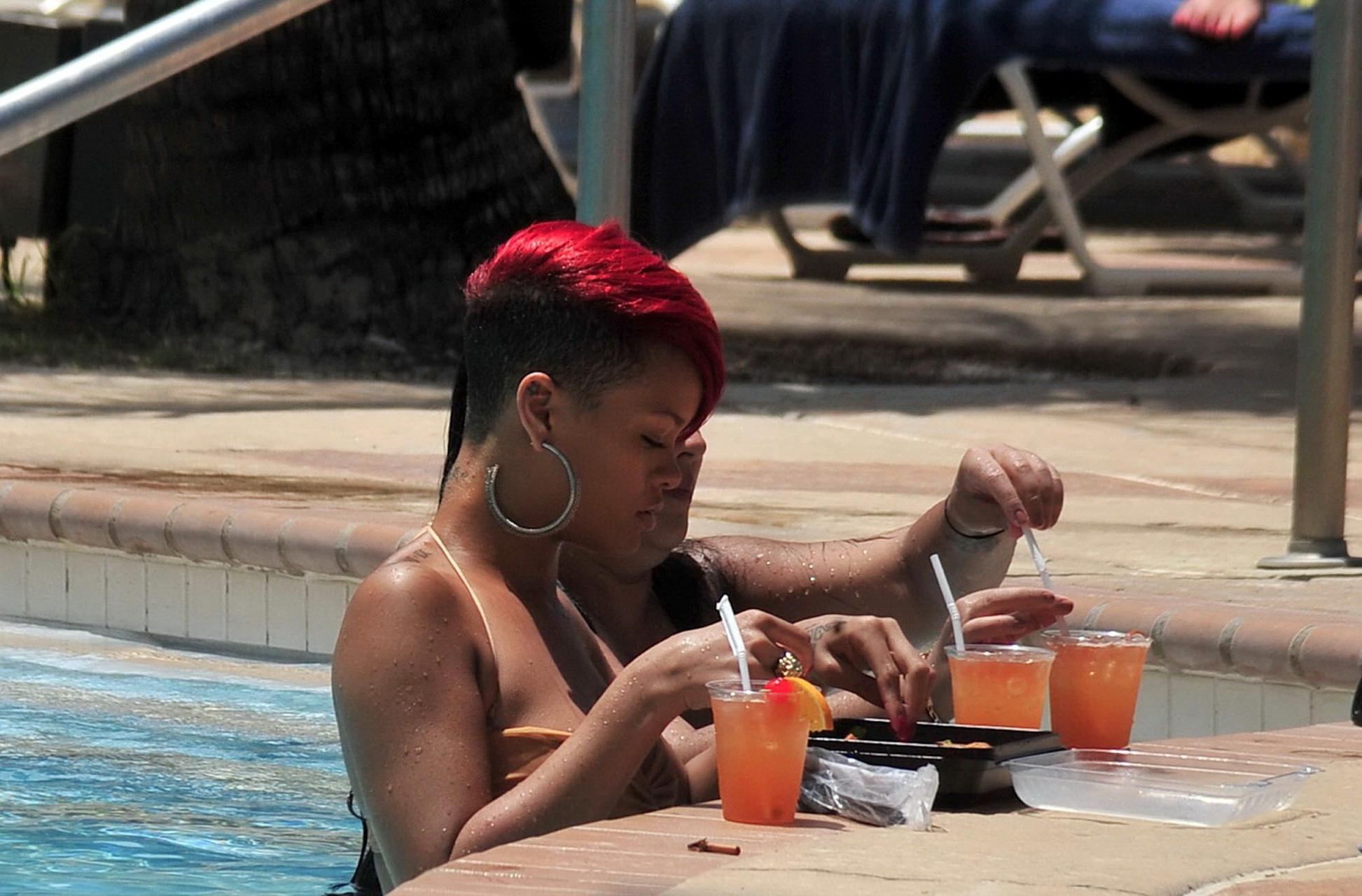 15P Rihanna showing some ass crack in wet bikini poolside in Barbados