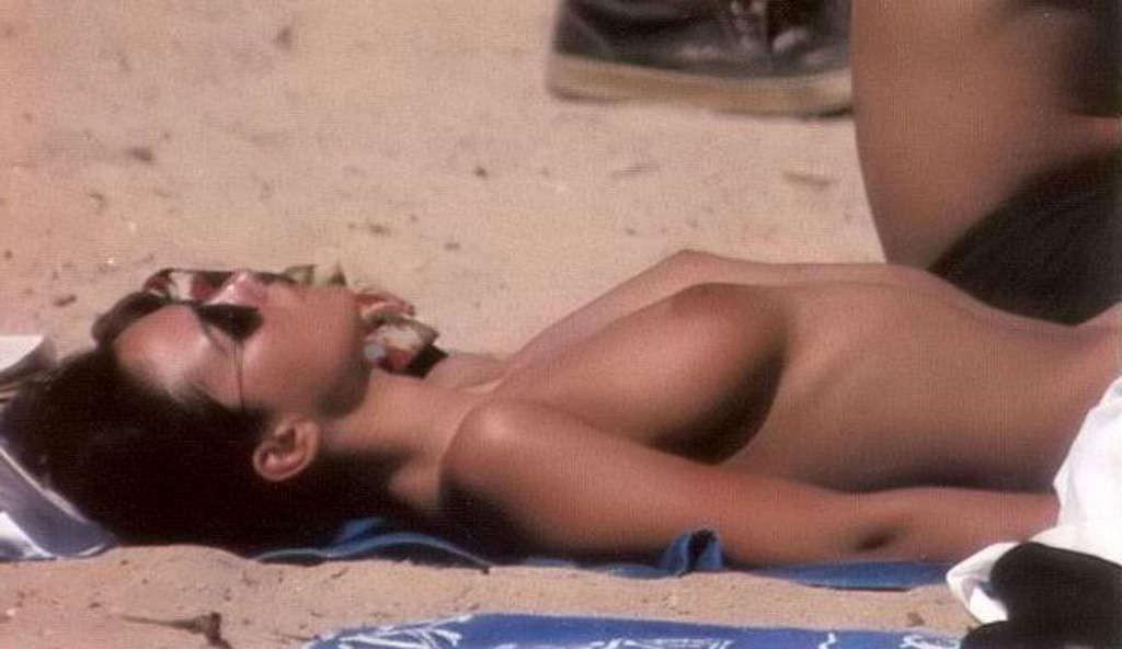 10P Monica Bellucci caught sunbathing topless on beach paparazzi shoots and nude in 