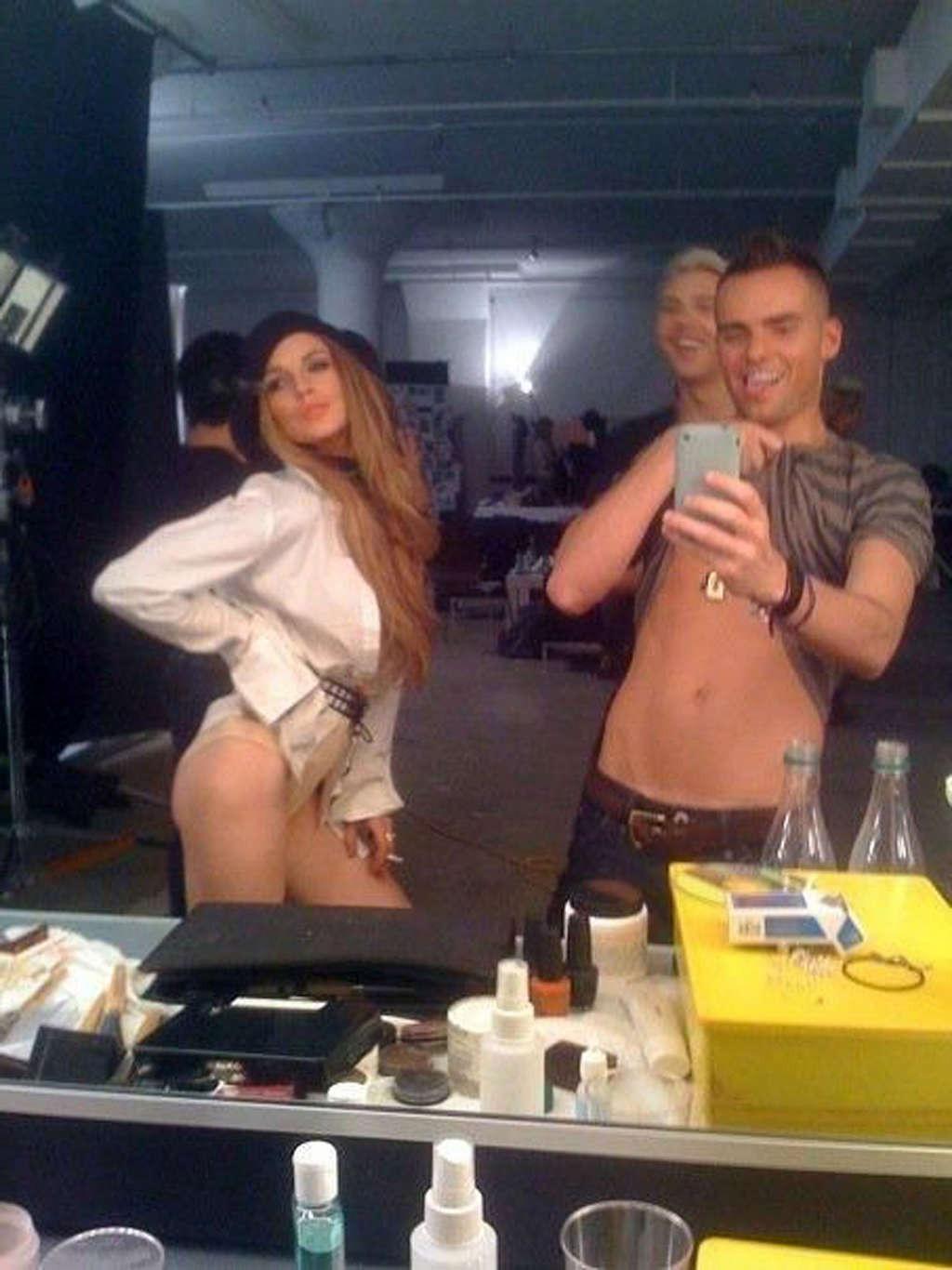 16P Lindsay Lohan posing topless for some photoshoot and upskirt