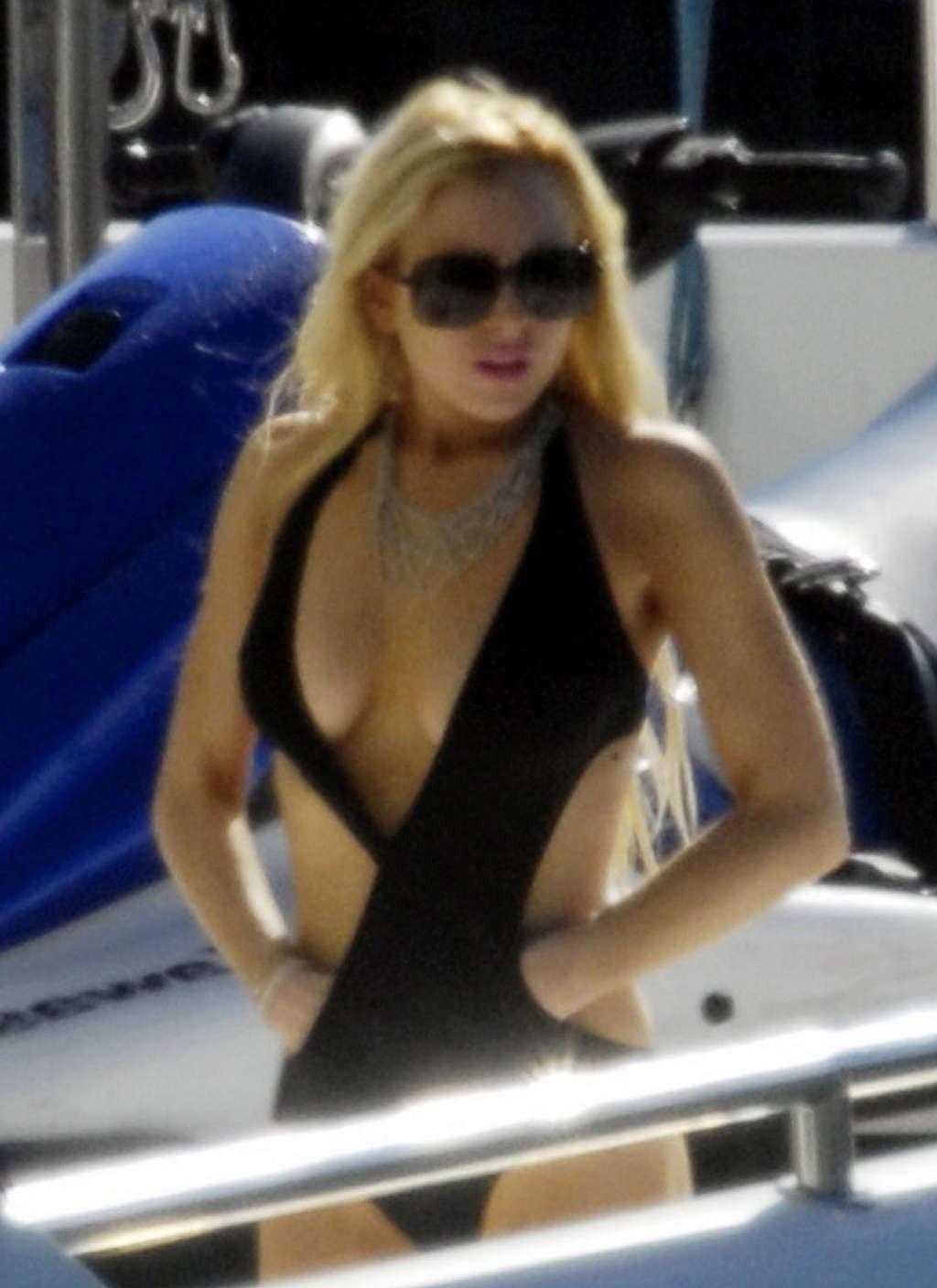16P Lindsay Lohan posing topless for some photoshoot and upskirt