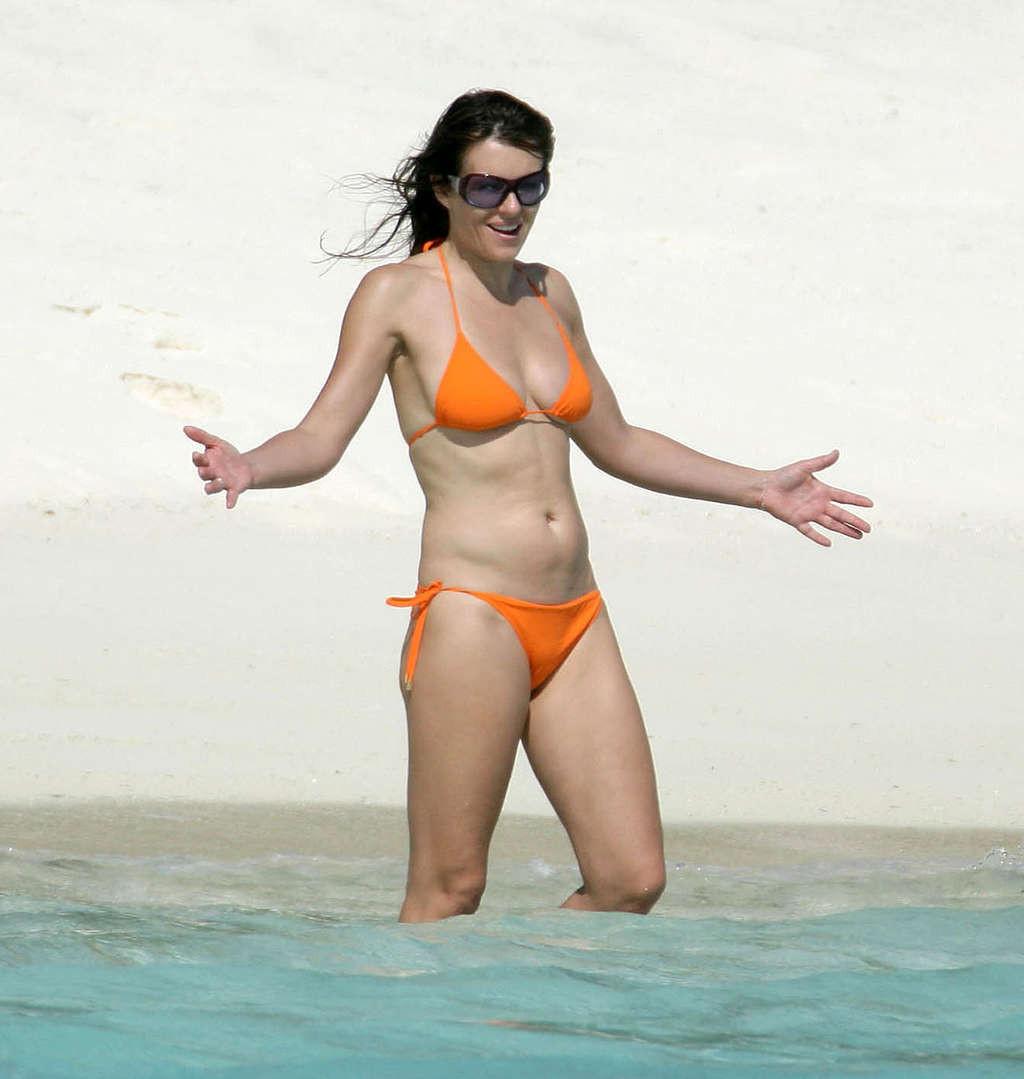 16P Elizabeth Hurley sunbathing in topless and showing extremely huge tits