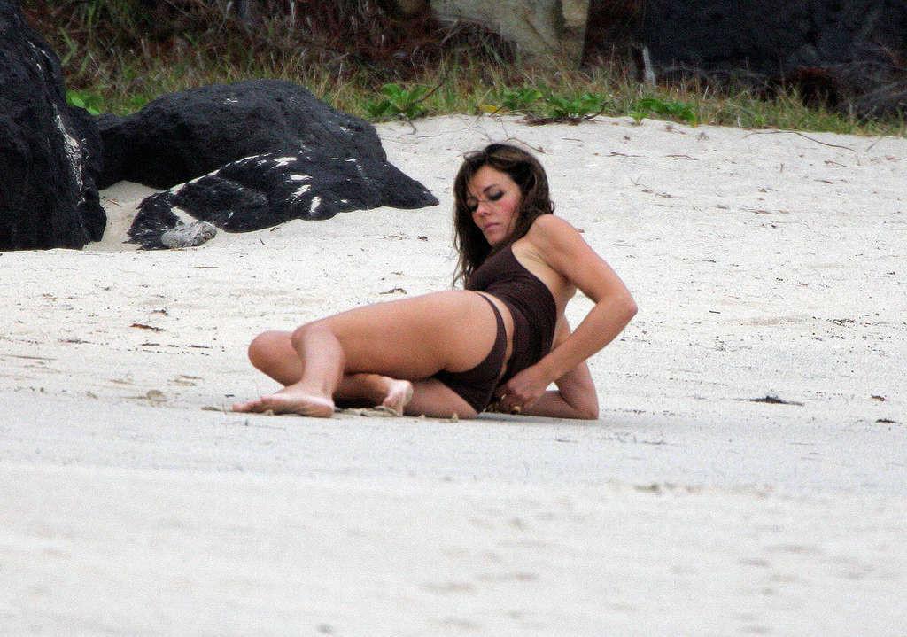 16P Elizabeth Hurley sunbathing in topless and showing extremely huge tits