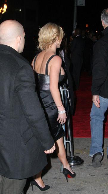 15P Britney Spears caught tanning deep cleavage
