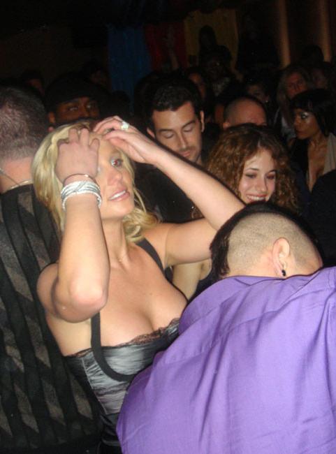 15P Britney Spears caught tanning deep cleavage