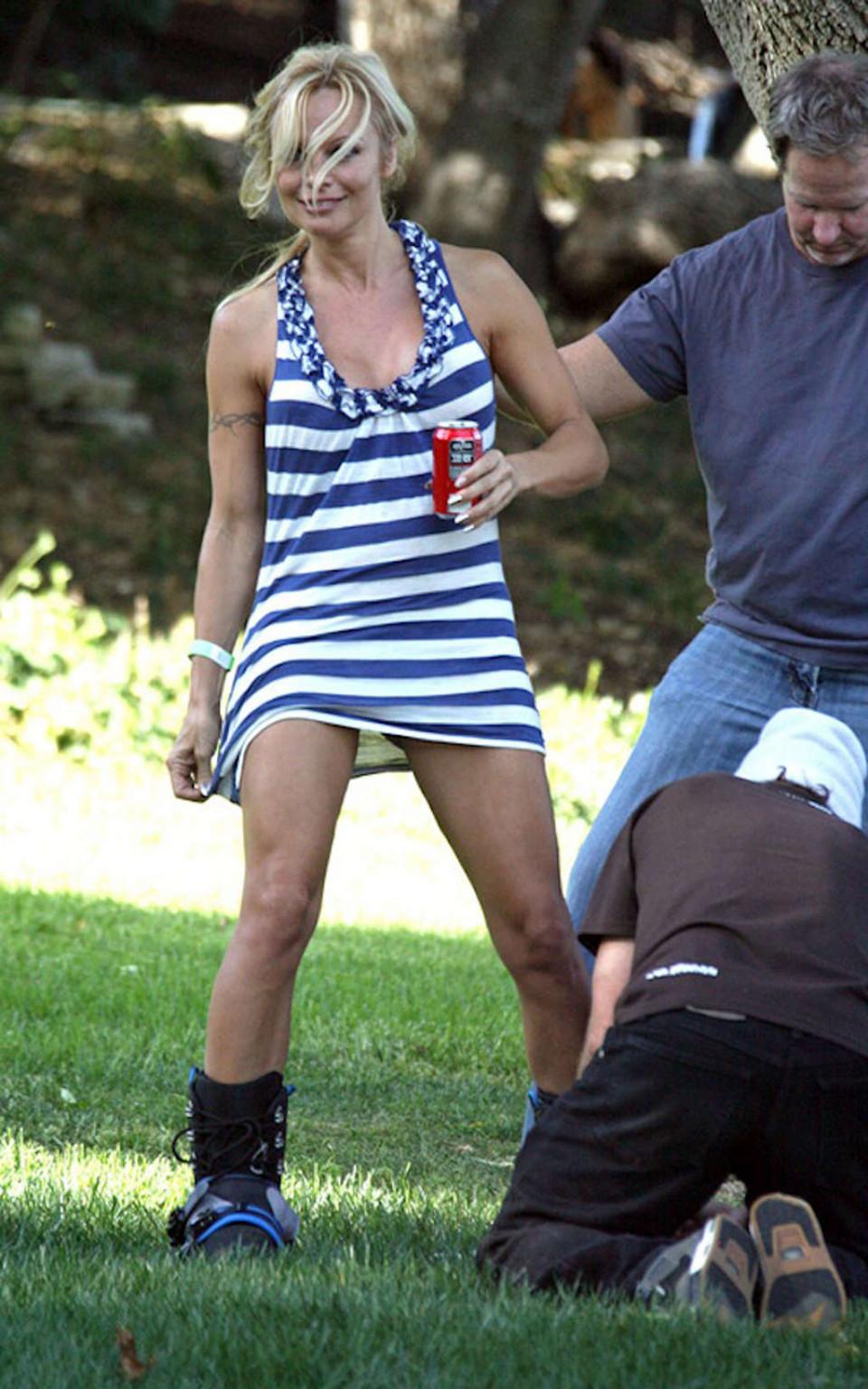 16P Pamela Anderson upskirt while snowbording on grass and squzzing boobs