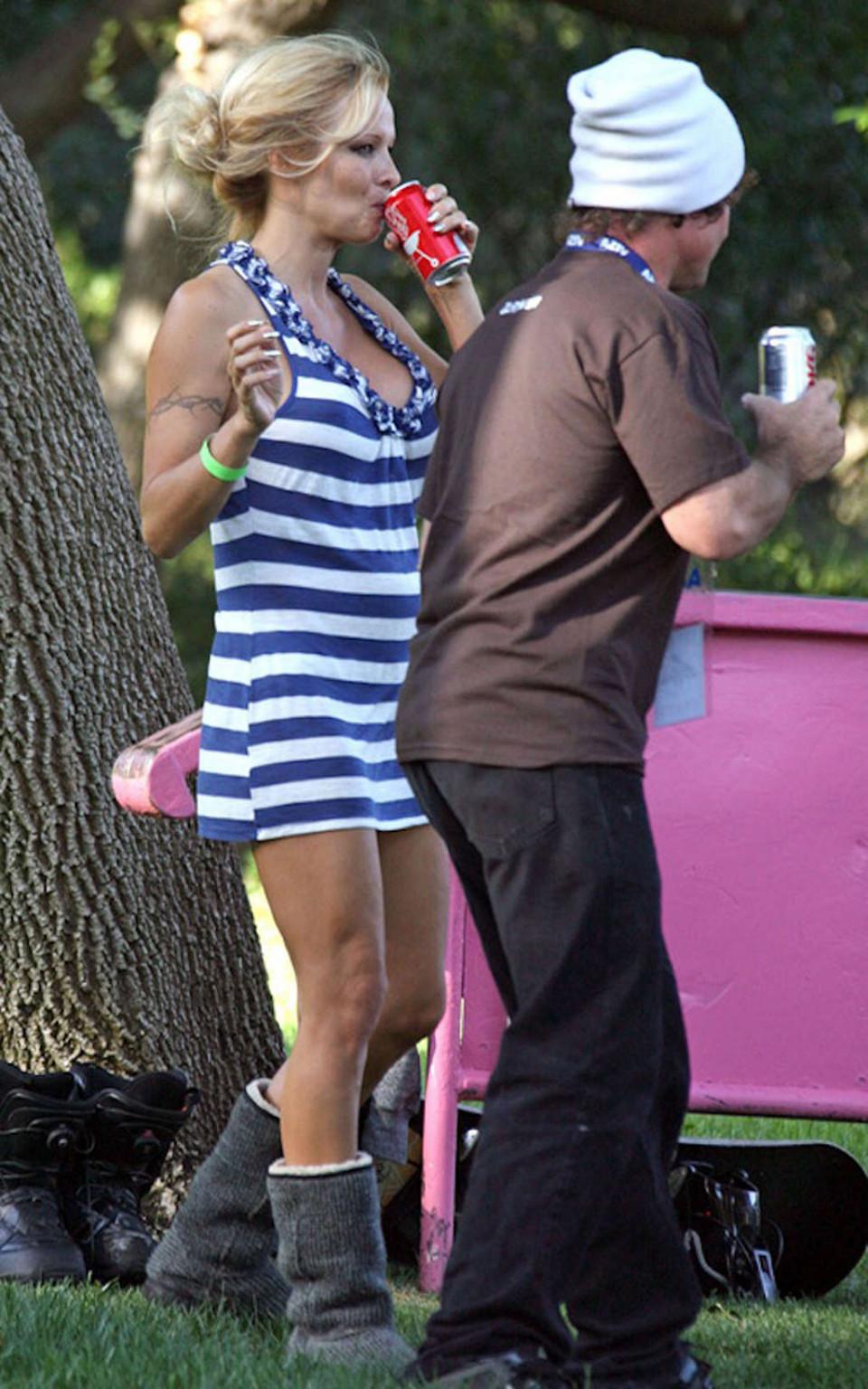 16P Pamela Anderson upskirt while snowbording on grass and squzzing boobs