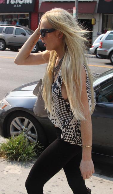 16P Lindsay Lohan juicy boobs in see through moment