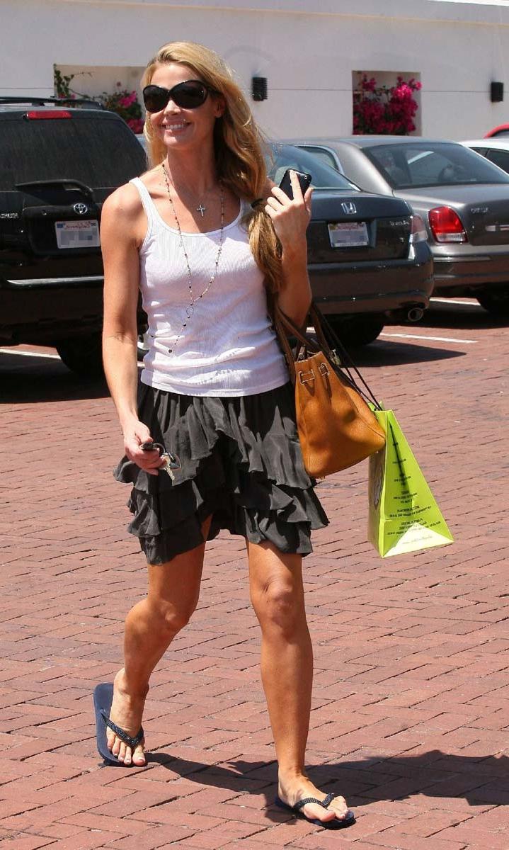 15P Denise Richards caught topless on the beach