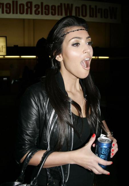 15P Kim Kardashian showing her big ass in tight dress