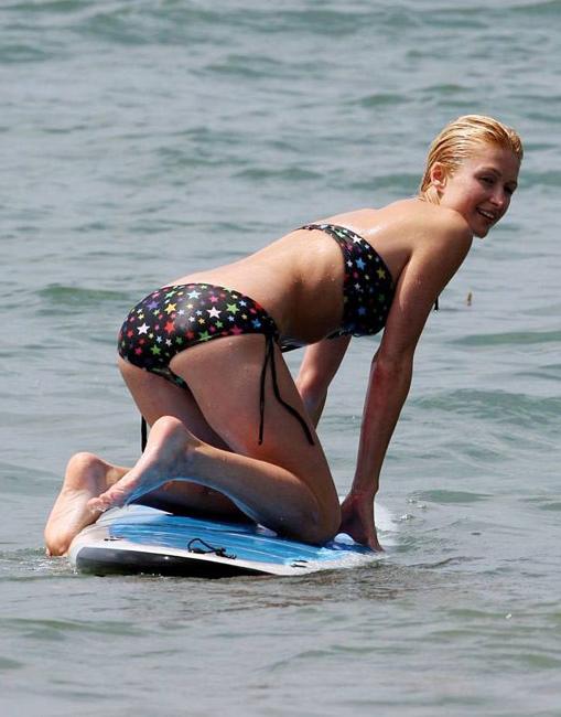 16P Celeb superstar Paris Hilton shows perky tits in the sea