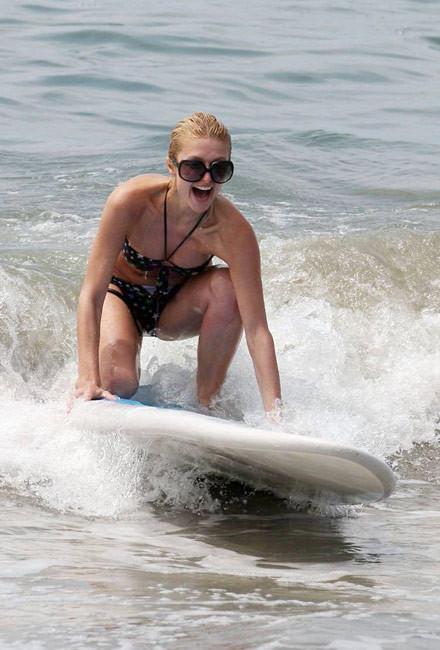 16P Celeb superstar Paris Hilton shows perky tits in the sea