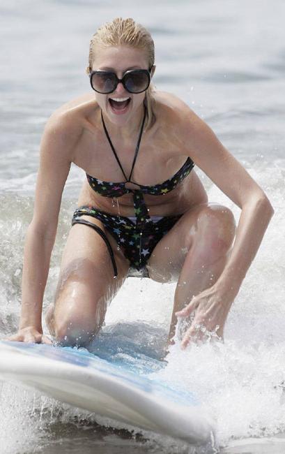 16P Celeb superstar Paris Hilton shows perky tits in the sea