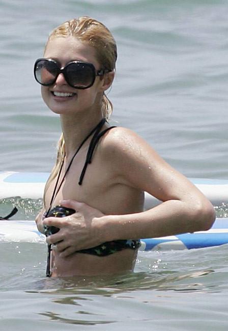 16P Celeb superstar Paris Hilton shows perky tits in the sea