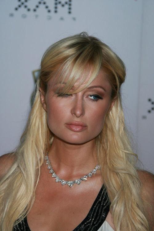 16P Paris Hilton showing her perky boobs and posing sexy in thong