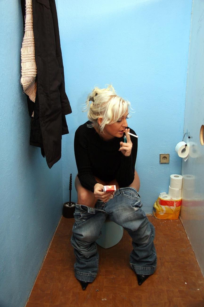 17P Cock hungry blonde sucks cock through hole in toilet wall