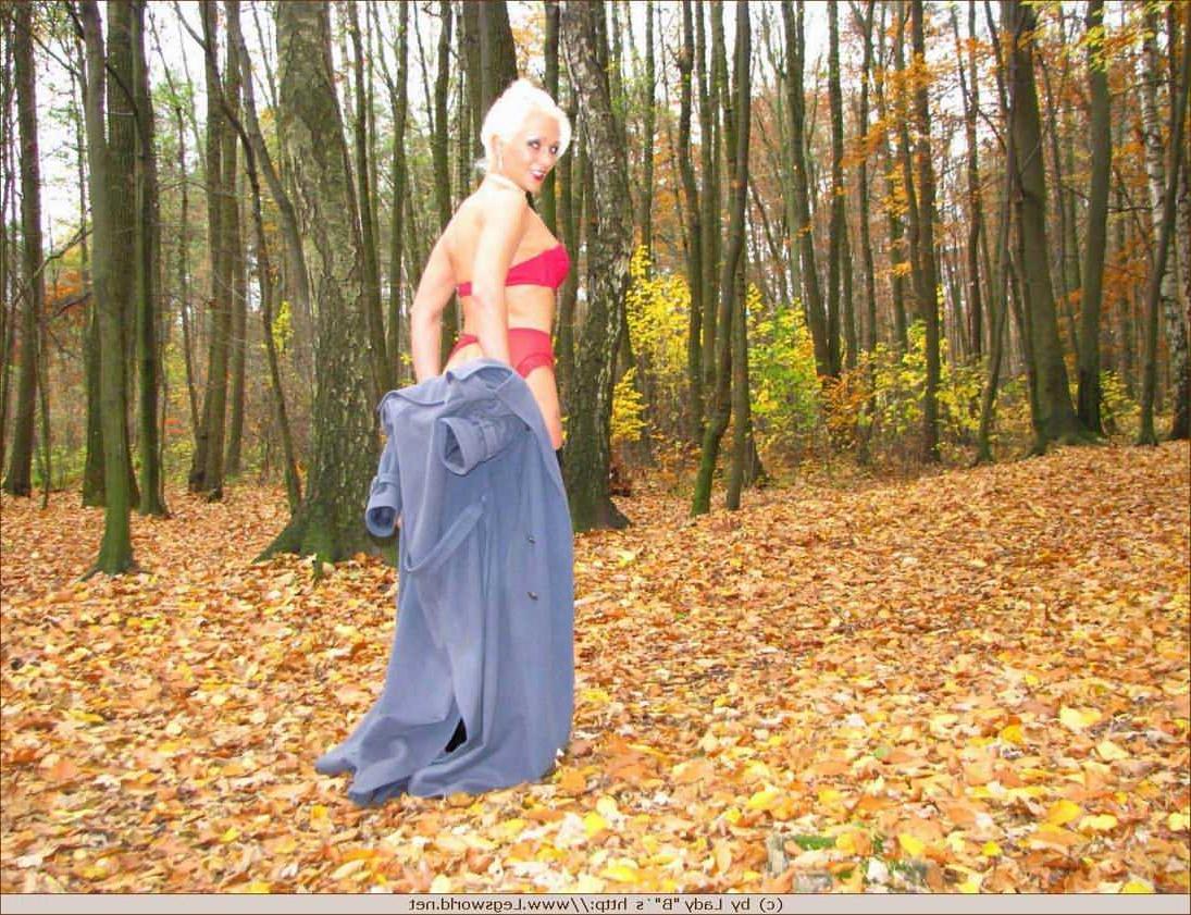 12P Blonde Ewa in stockings and high boots outdoors