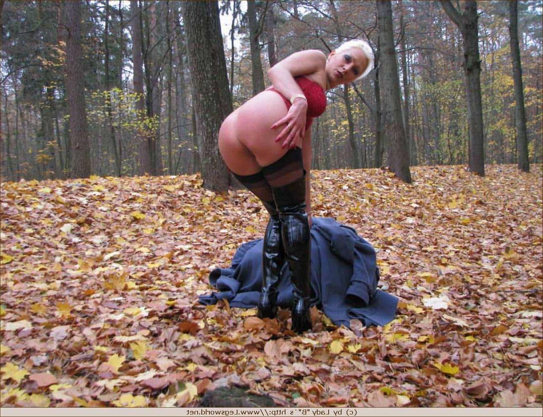 12P Blonde Ewa in stockings and high boots outdoors