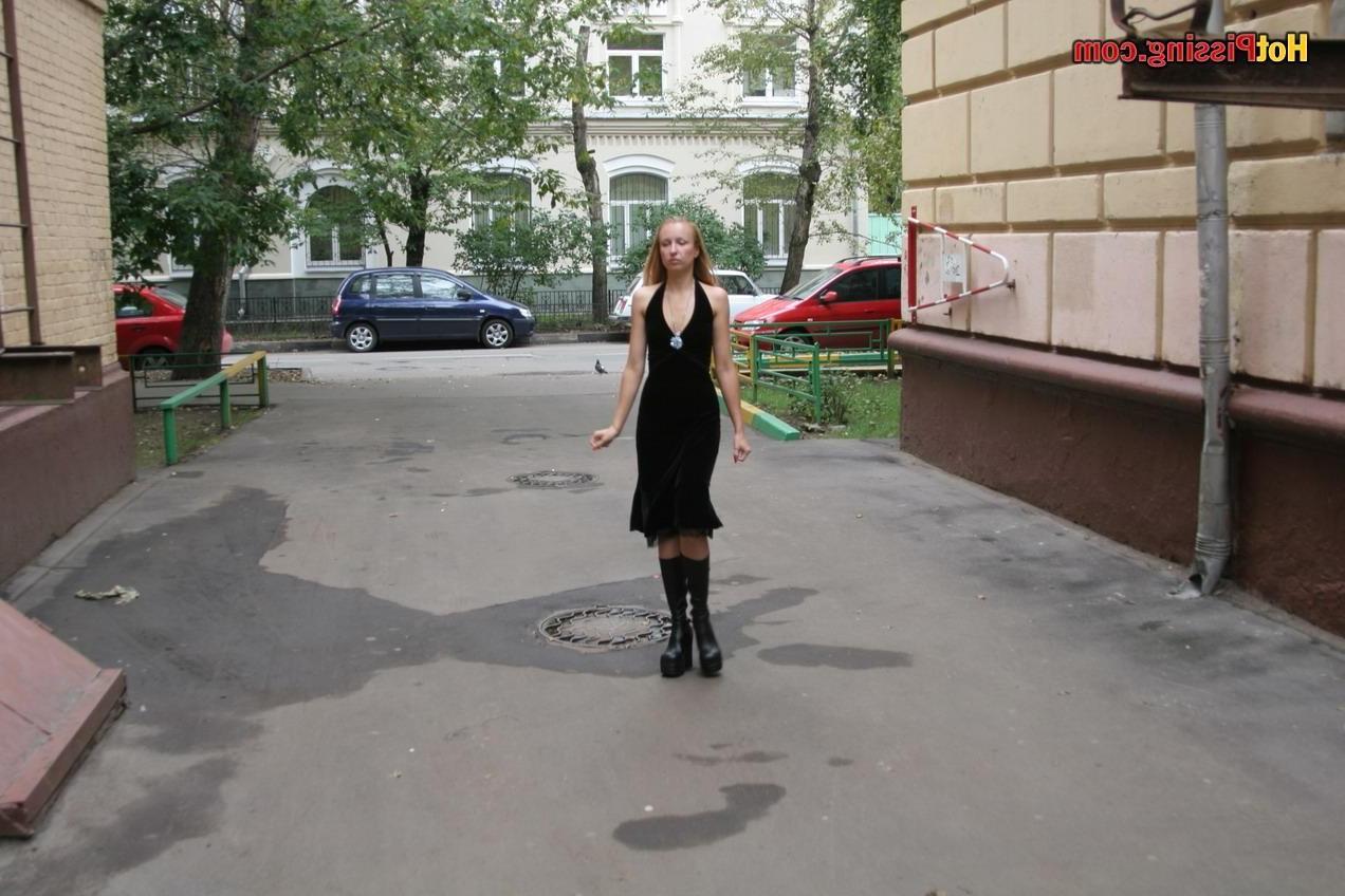 15P Gothic lady in black dress and platform boots does a pee in the street