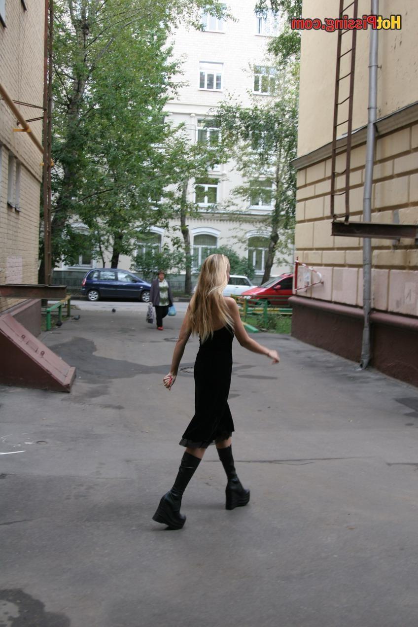 15P Gothic lady in black dress and platform boots does a pee in the street