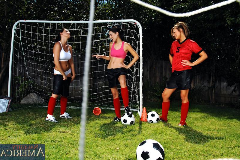 14P Three sexy girls warm up on the soccer field