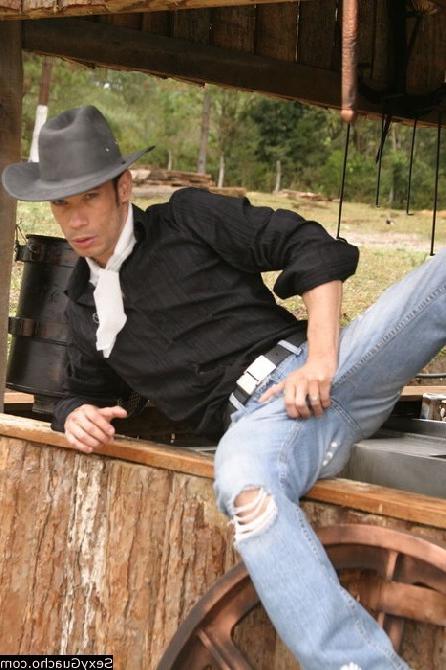12P Cowboys cock dangling down at the ground while he looks into camera