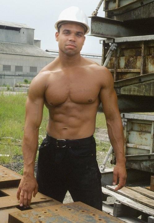 20P A latino muscle showing off at a deserted elevator
