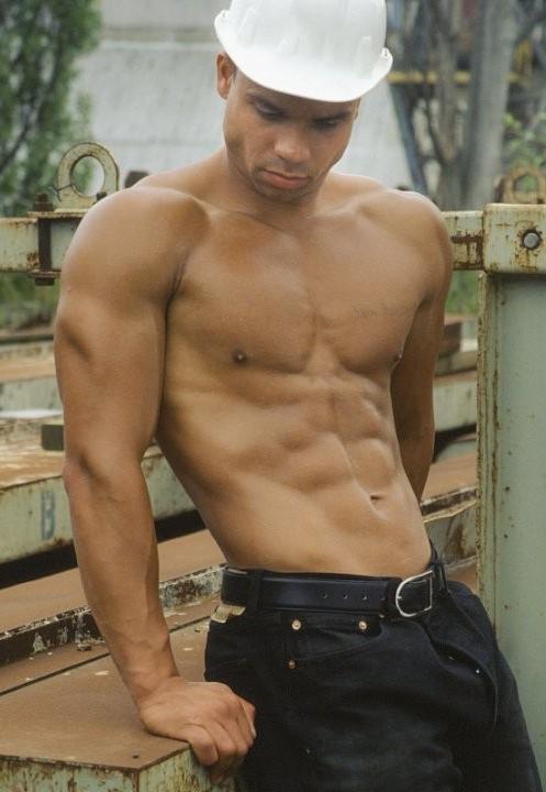 20P A latino muscle showing off at a deserted elevator