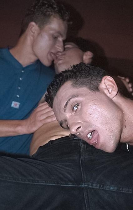 20P Three smooth tanned dudes fucking and cumming kick on a sofa