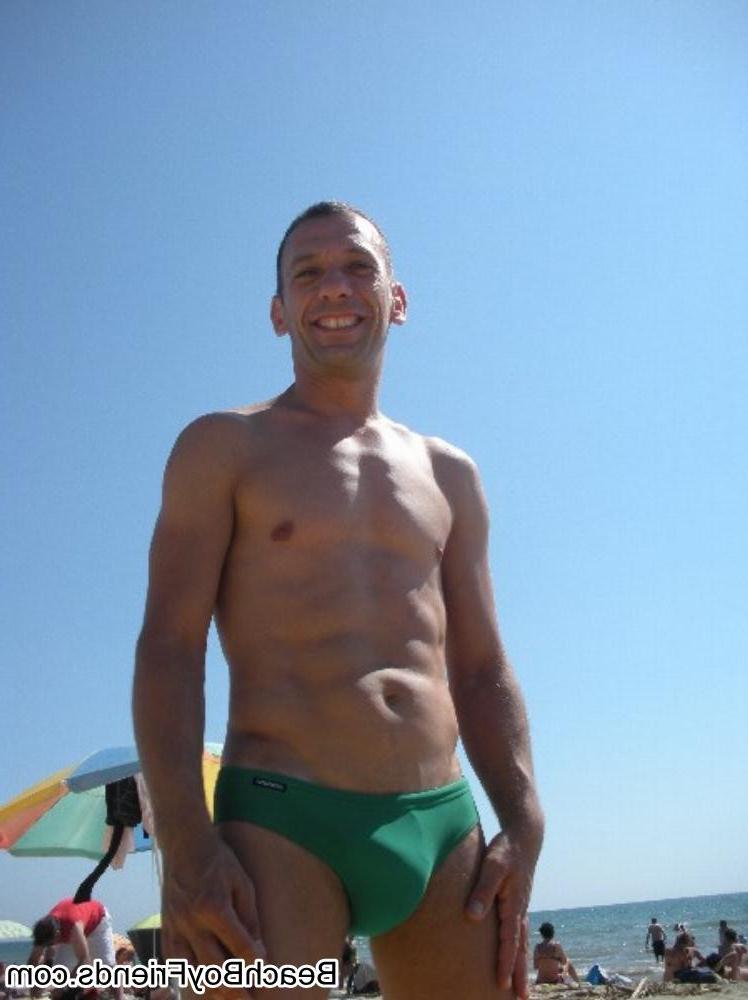 10P Big muscled dudes are wearing tight trunks at the beach