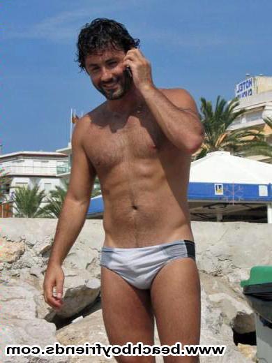 10P Good looking dudes are topless at the beach showing some abs