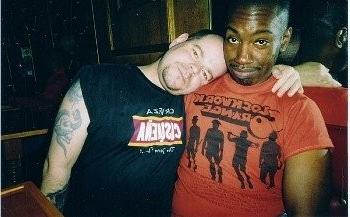 10P Two black dudes are having fun wrestling on the bed