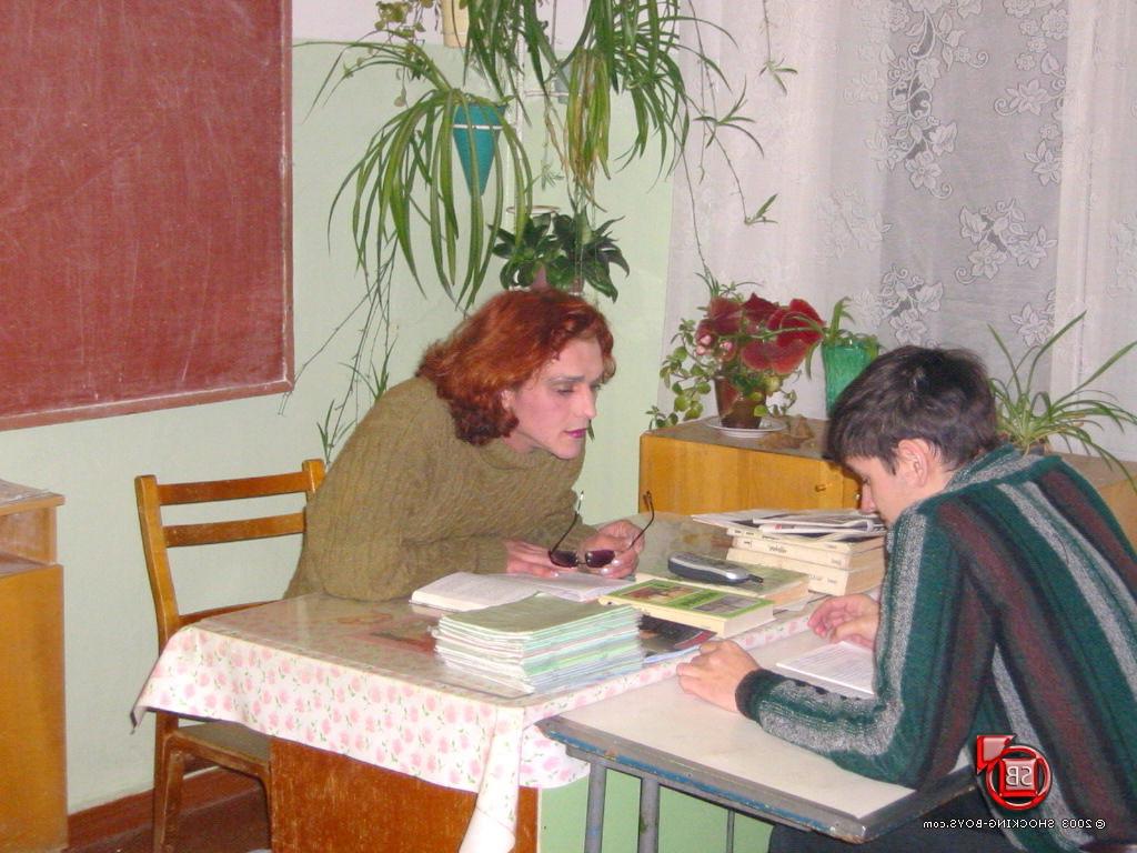 9P A young man dressed in a teachers clothes nastily involves another younger schoo