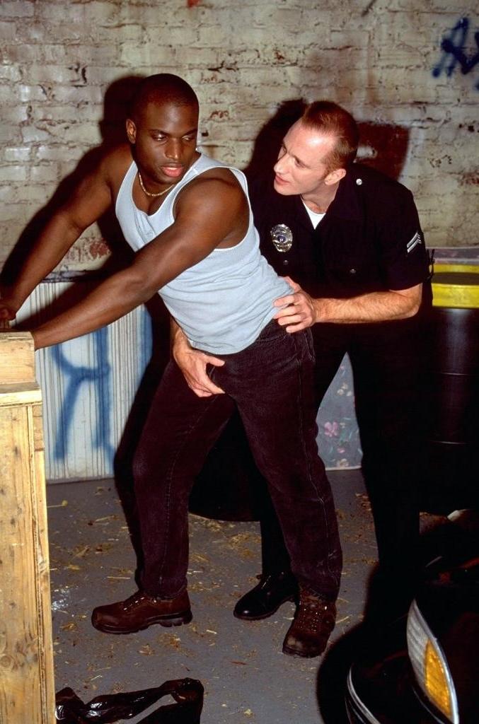 20P Horny ebony gay enjoys sucking police white cock in outdoor