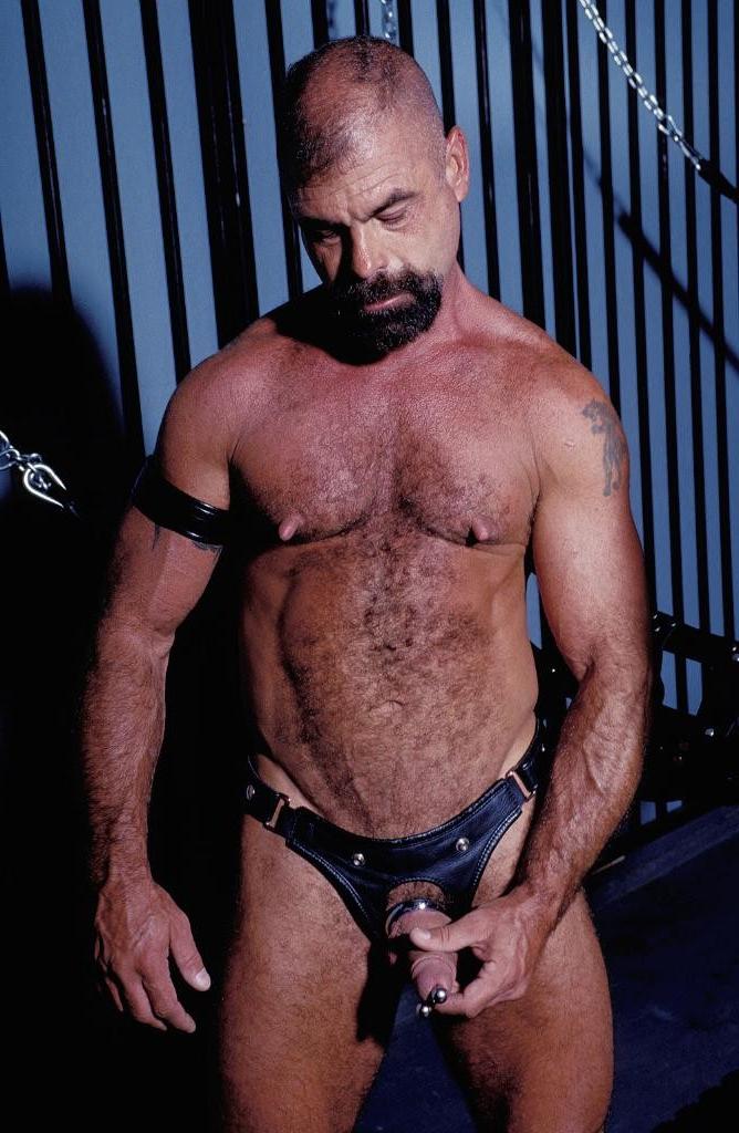 20P Teasing hairy gay in leather love flashing his pierced cock