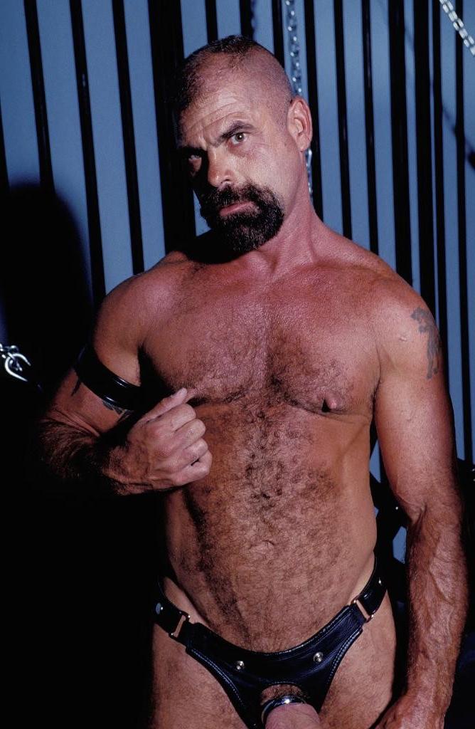 20P Teasing hairy gay in leather love flashing his pierced cock