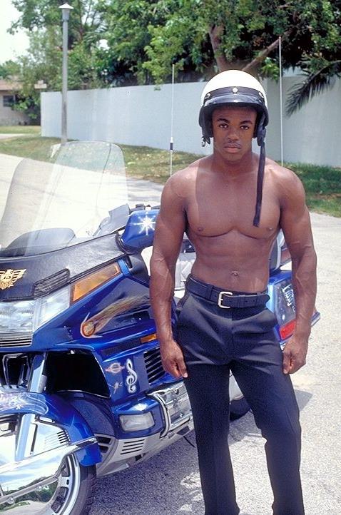 20P Naked ebony gay loves flashing his huge cock while posing