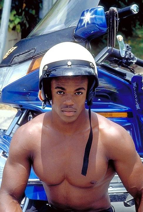 20P Naked ebony gay loves flashing his huge cock while posing
